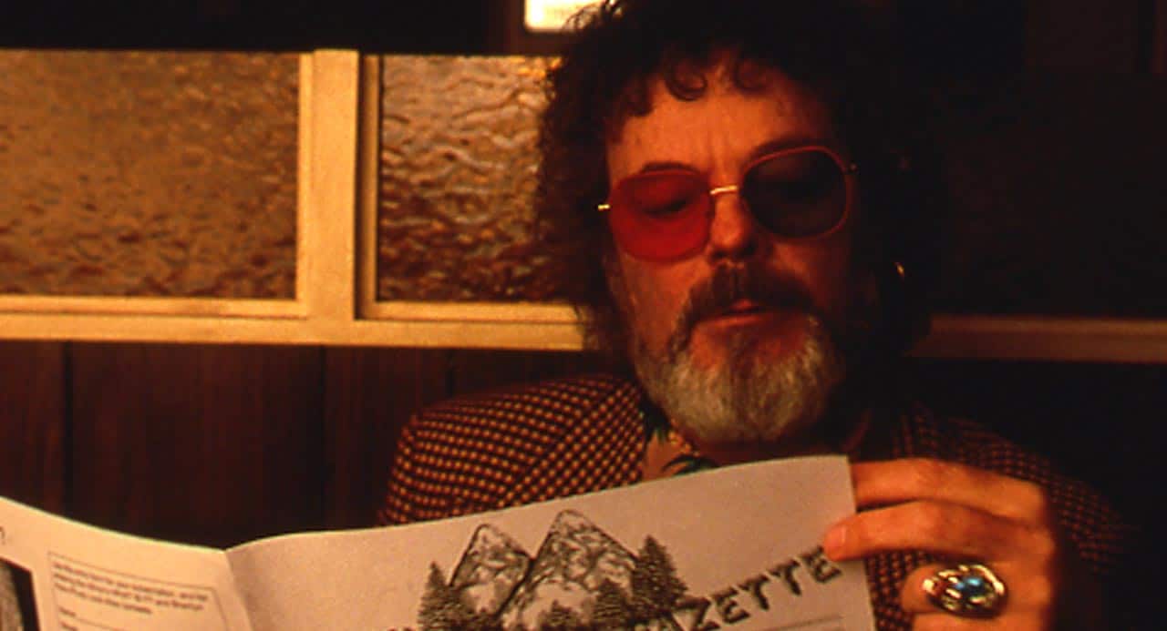Dr. Jacoby reading the Twin Peaks Gazette