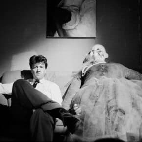 David Lynch next to the clown doll in Ben's apartment