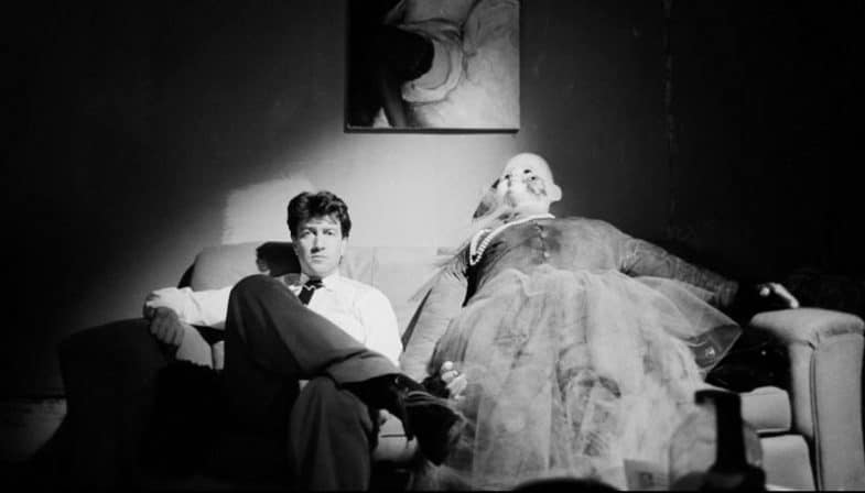 David Lynch next to the clown doll in Ben's apartment