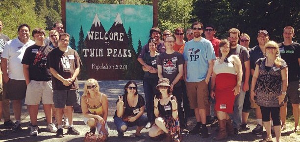 Group shot in front of the Welcome to Twin Peaks sign